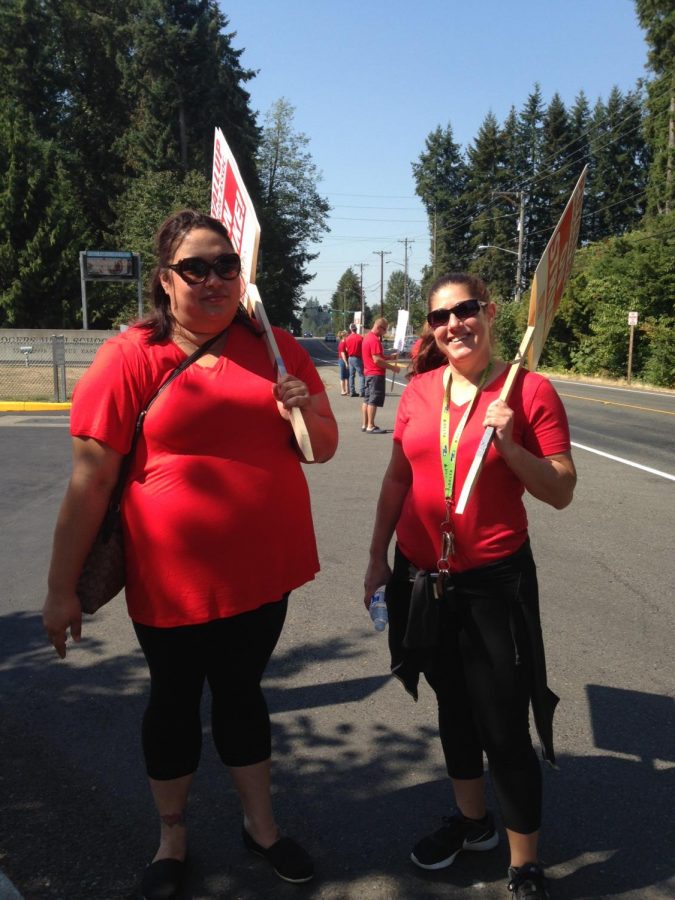 Teachers Jaclyn Fisher and Stephanie Holubowsky picketing outside the school on Sept. 5.  