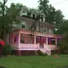 Firefighters respond to an attic fire at a nine-apartment building after a lightning strike in Summit, New Jersey