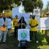 Residents gather at a rally in Emerald Hills to oppose a housing project near a wildfire hazard zone