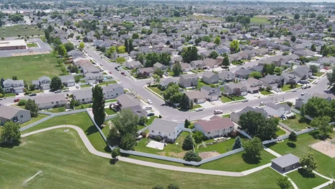 Salt Lake County Homebuyers Need $186,000 in Income to Afford the Median Priced Single Family Home, a Two Year High in the Second Quarter of 2026 A suburban home in Salt Lake County with mountains in the background