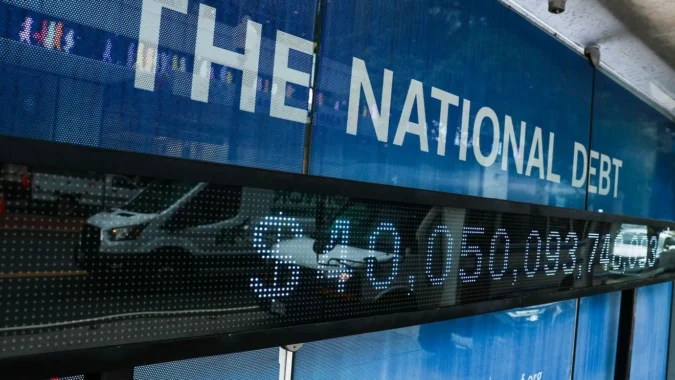 Capitol dome with a graphic showing the U.S. national debt crossing $40 trillion