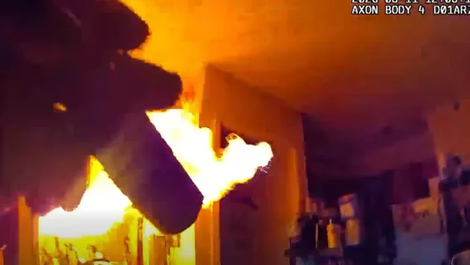 Deputies in body camera video confronting flames during an eviction attempt in an Oklahoma apartment