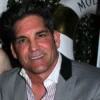 Grant Cardone speaking on a phone screen about a $5,000 house hacking strategy