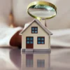 First-Time Homebuyers Face Closing Costs, Taxes, Insurance and Utility Bills That Can Add Thousands Before and After Closing, Freddie Mac and Ownwell Say A first-time homebuyer reviews paperwork and mortgage costs with a calculator on a table
