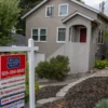 A row of suburban homes as rising mortgage rates pressure buyers and refinancers