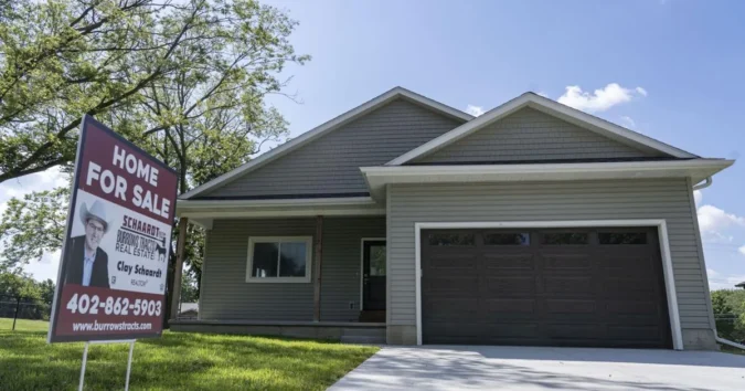 Pawnee City’s $50,000 Homebuyer Incentive Has Drawn One Taker as the Nebraska Town Tries to Fill Vacant Lots and Keep Young Families Vacant lot and newly built houses in a small Nebraska town