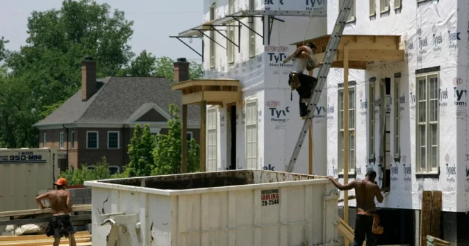 For sale sign outside a home as rising mortgage rates make buying less affordable