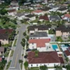 Mortgage Rates Jump to Their Highest Level Since 2025 as Bond Market Turmoil Deepens the Housing Affordability Crunch for U.S. Buyers and Homebuilders Nationwide A row of suburban homes as mortgage rates rise and affordability remains strained