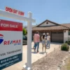 Pew Study Says Tight Mortgage Lending Standards Are Keeping Many U.S. Borrowers Out as 30 Year Rates Rise and Existing Home Sales Slip Again A for-sale home sign outside a house with the housing market under pressure from mortgage rates
