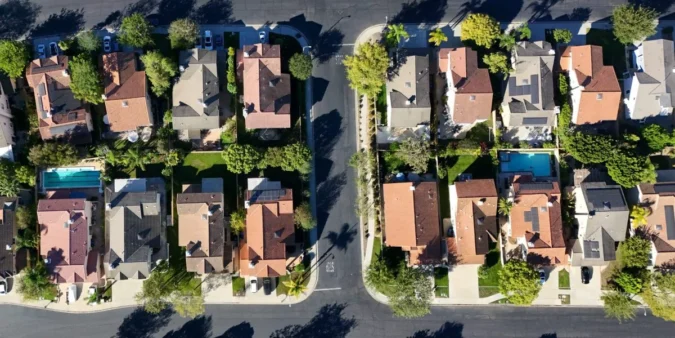 Mortgage Rates Near 7 Percent Are Raising Monthly Costs and Cooling Homebuying Demand as Sales Slow, Sellers Offer More Concessions, and Prices Stay Elevated Nationwide A for sale sign in front of a suburban home as mortgage rates rise and buyers hesitate