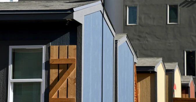 Across Austin, Denver and Portland, Low-Income Apartments Are Sitting Vacant While the Country’s Poorest Renters Face a Severe Shortage of Housing They Can Actually Afford A man sits inside a homeless shelter as vacant affordable apartments remain out of reach