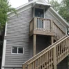 A tenant writes a rent check as Michigan landlords are required to offer a fee-free payment option