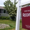 U.S. Existing Home Sales Fall to Slowest Pace in More Than a Year as Mortgage Rates and Prices Keep Climbing For sale signs line a neighborhood street as U.S. home sales slow and prices remain high