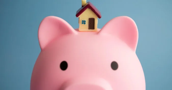 A $200,000 Home Equity Loan Would Cost About $1,927 to $2,448 a Month in September 2026 as Rates Hold Near 8.14 Percent A suburban home with a calculator and mortgage paperwork on a table