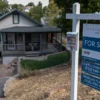 Mortgage Rates Near 7 Percent Tighten the U.S. Housing Market as Buyers Face Higher Costs, Sellers Pull Listings and One New Jersey Couple Keeps Searching A couple reviewing home listings as mortgage rates climb near 7 percent
