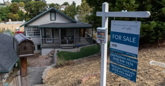 A couple reviewing home listings as mortgage rates climb near 7 percent