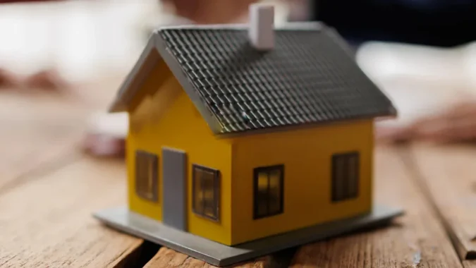 US Mortgage Rates Climb Above 7 Percent as 30 Year Loans Hit 7.49 Percent, Adding About 160 Dollars to Monthly Payments on a 400000 Dollar Home A row of homes with a for sale sign as mortgage rates move above 7 percent