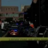 Police activity outside a Minneapolis apartment complex after a downtown shooting