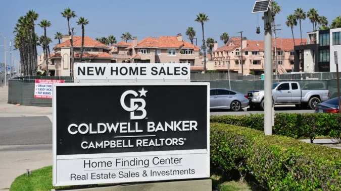 Mortgage Refinance Demand Falls to Less Than Half of Last Year as 30-Year Rates Climb to 7.49 Percent in the Latest MBA Survey A for-sale house with a mortgage rate sign in front of it