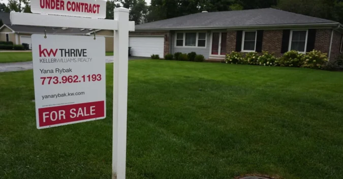 A for sale sign outside a home as mortgage rates rise and housing affordability weakens
