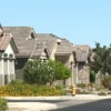 Rising Mortgage Rates Push Surprise Homebuyers to the Sidelines as Northwest Growth Continues and Builder Incentives Try to Offset Higher Monthly Costs New homes under construction in Surprise, Arizona with a real estate sign in front