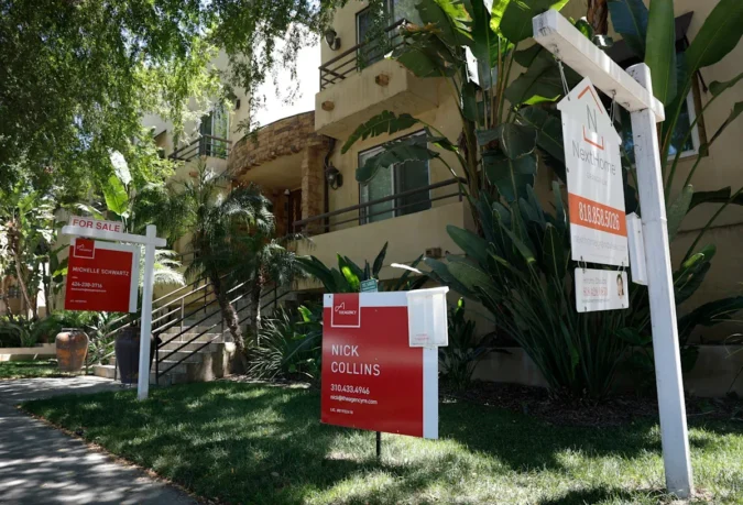 A row of suburban homes with a mortgage rate chart overlay