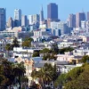 San Francisco Two Bedroom Rent Tops New York City by Nearly 900 Dollars as Zumper Says AI Hiring and Tight Supply Push Prices Higher San Francisco skyline with apartment buildings and a rental market price comparison