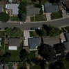Florida Realtors Study Says Removing Property Taxes Could Lift Home Values 7% to 9% Overnight as Amendment 3 Debate Centers on Affordability A Florida home exterior with a for sale sign and a calculator beside it