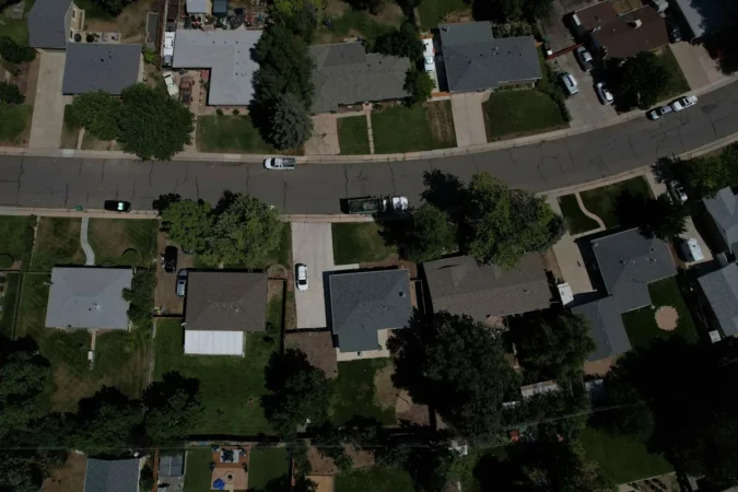 Florida Realtors Study Says Removing Property Taxes Could Lift Home Values 7% to 9% Overnight as Amendment 3 Debate Centers on Affordability A Florida home exterior with a for sale sign and a calculator beside it